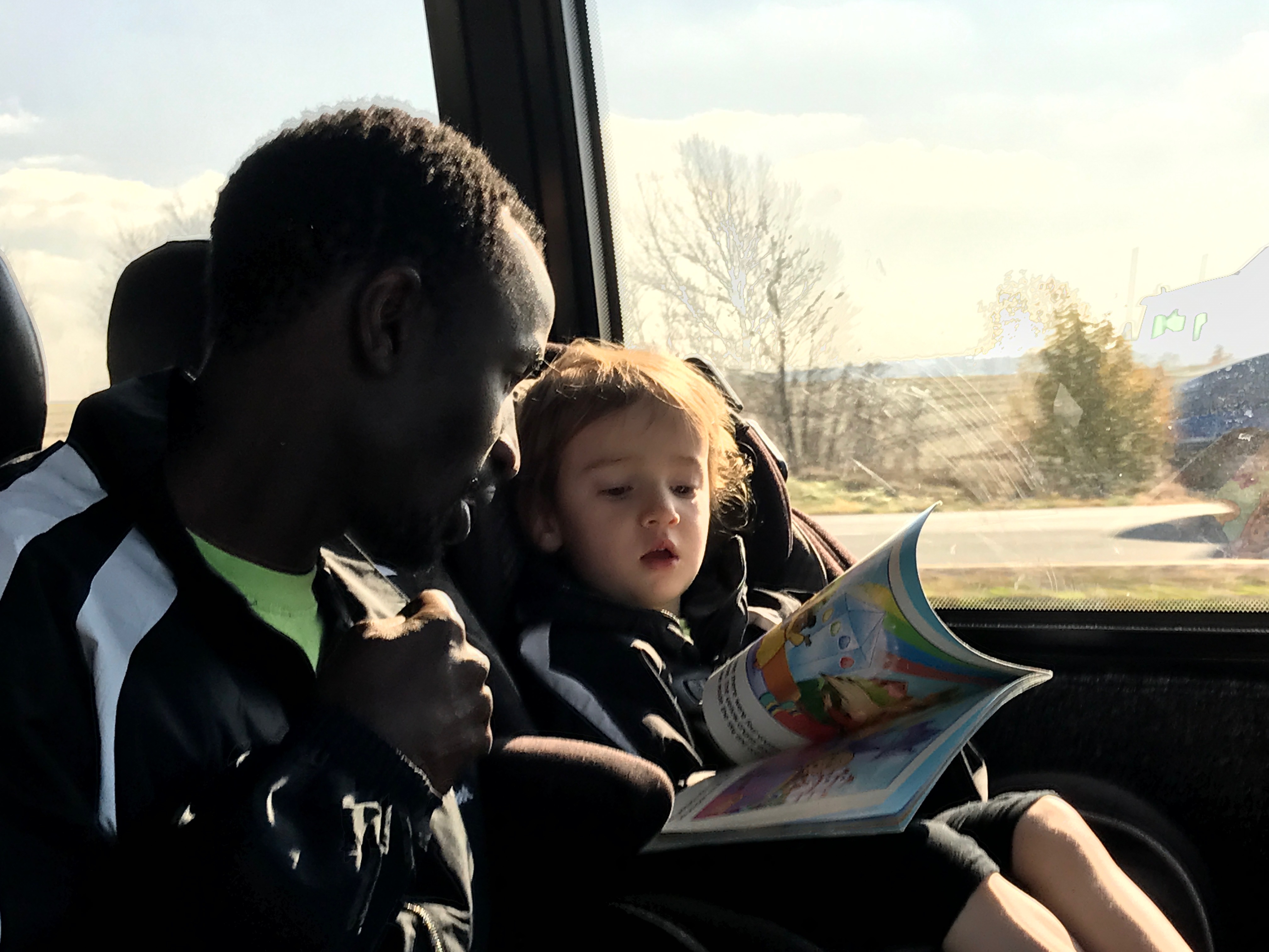 uncle-saul-reading-to-josie-on-the-bus_30628982693_o